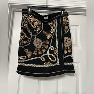 Caché Printed Skirt is a size 10.